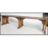 A good pair of 19th century French country pine refectory pig benches. Each with shaped single plank
