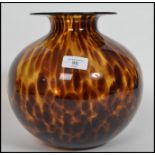 A 1930s Art Deco studio glass baluster vase in a tortoise shell colourway having a tapering neck