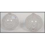 A pair of early 19th century Nailsea glass witch balls having a banded white design.