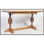 A 20th century oak refectory dining table with rec