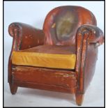 A 1930's French leather club armchair being raised on squared legs with cloud shaped back rest