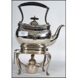 A silver plated 20th century spirit burner kettle raised on stand with claw feet makers stamp to