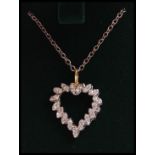 A white gold heart shaped diamond adorned ladies p