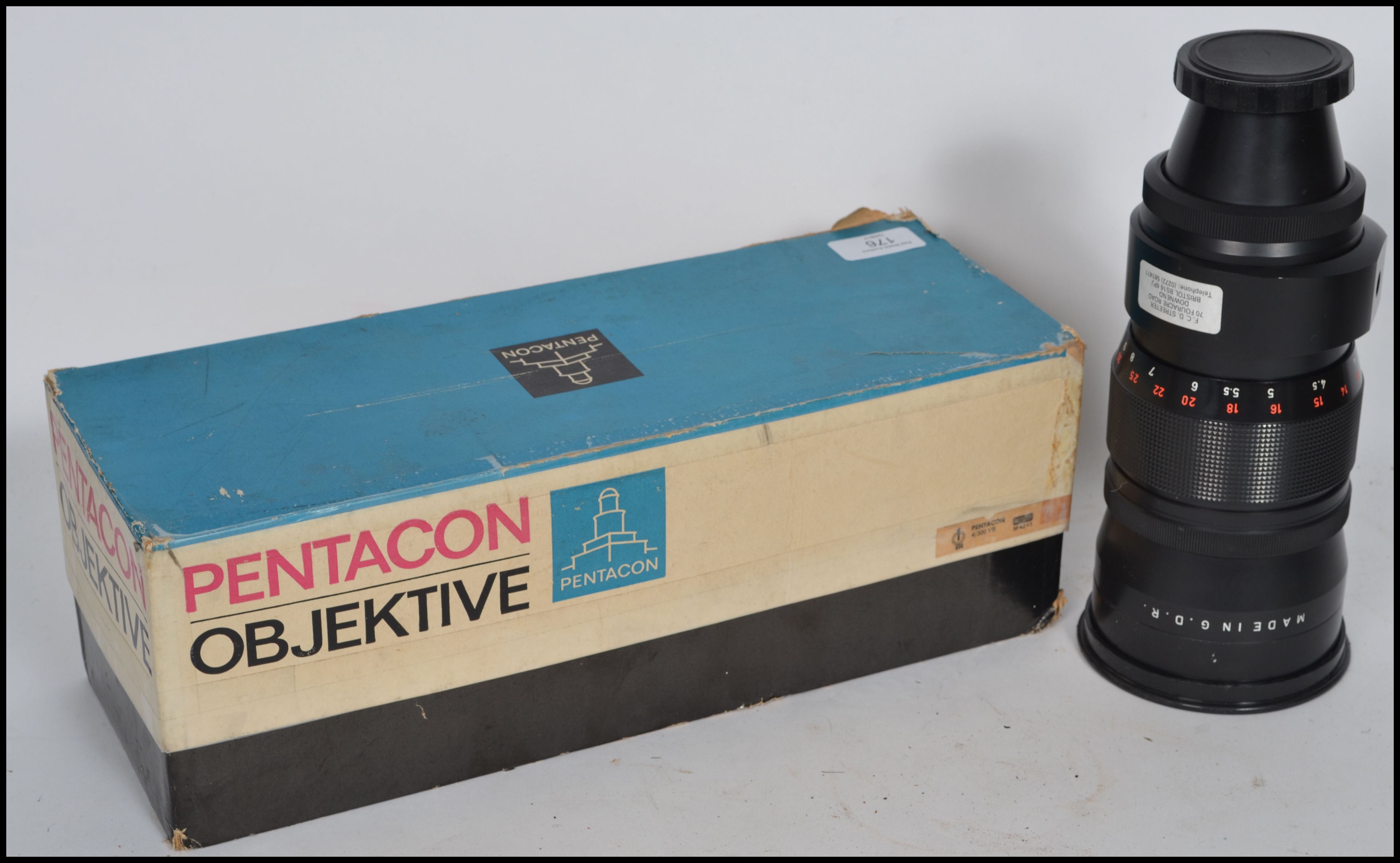 A vintage Pentacon Objektive 4/300 VB M42 X 1 Camera Telephoto Lens complete in the original box.