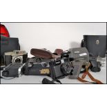 A large collection of vintage 20th century cinematography / photography cameras lenses and equipment