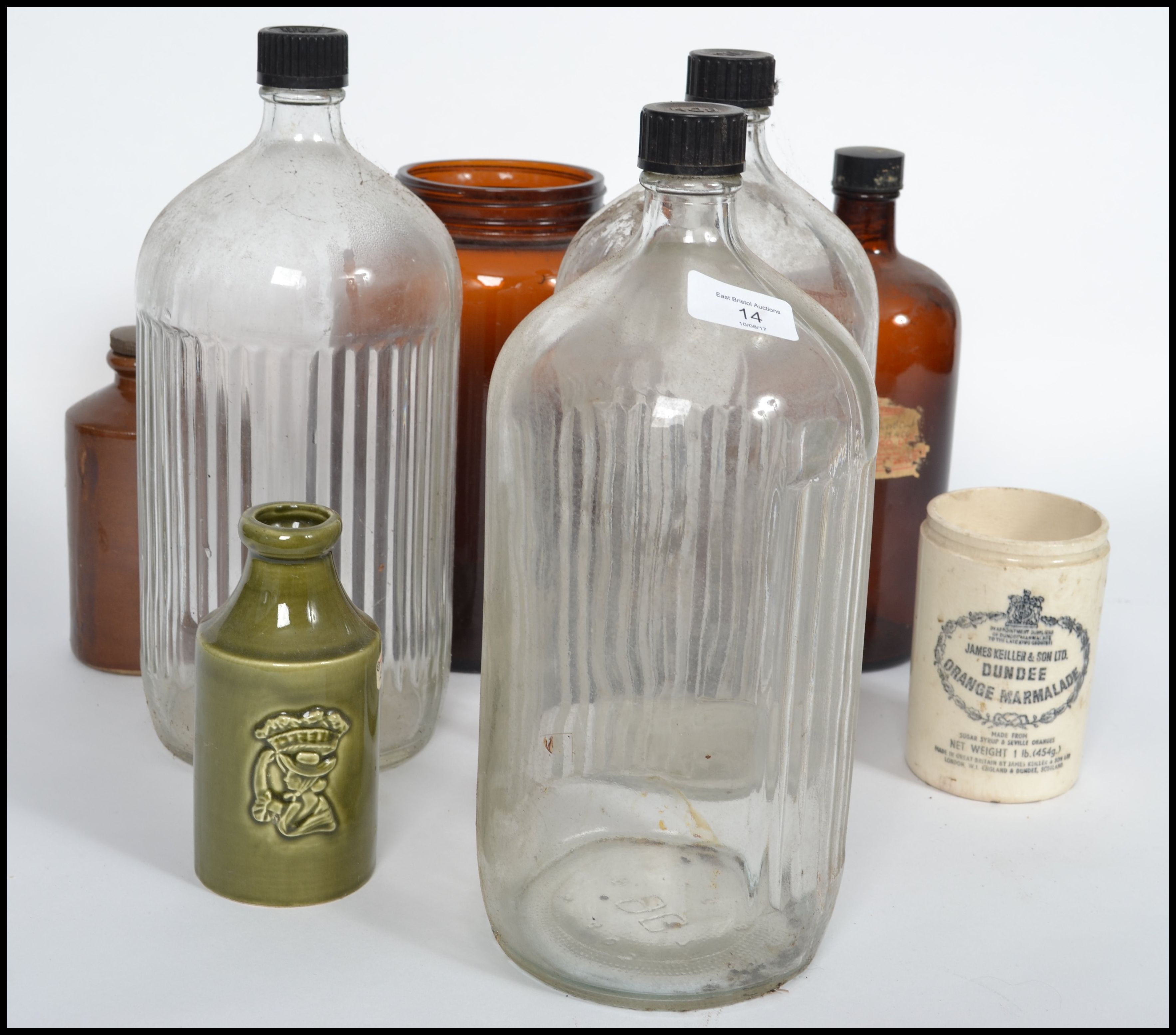 A small collection of vintage bottles and jars dating from the late 19th century to include