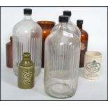 A small collection of vintage bottles and jars dating from the late 19th century to include