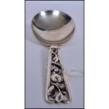 A large Danish silver  serving spoon with fabulous pierced rococo handle being marked Johannes