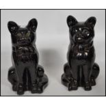 A pair of 19th century Victorian ceramic Jackfield Staffordshire earthenware cat figurines having