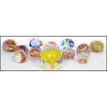 A good collection of 12 vintage studio glass paperweights to include milliefiori, bubble control
