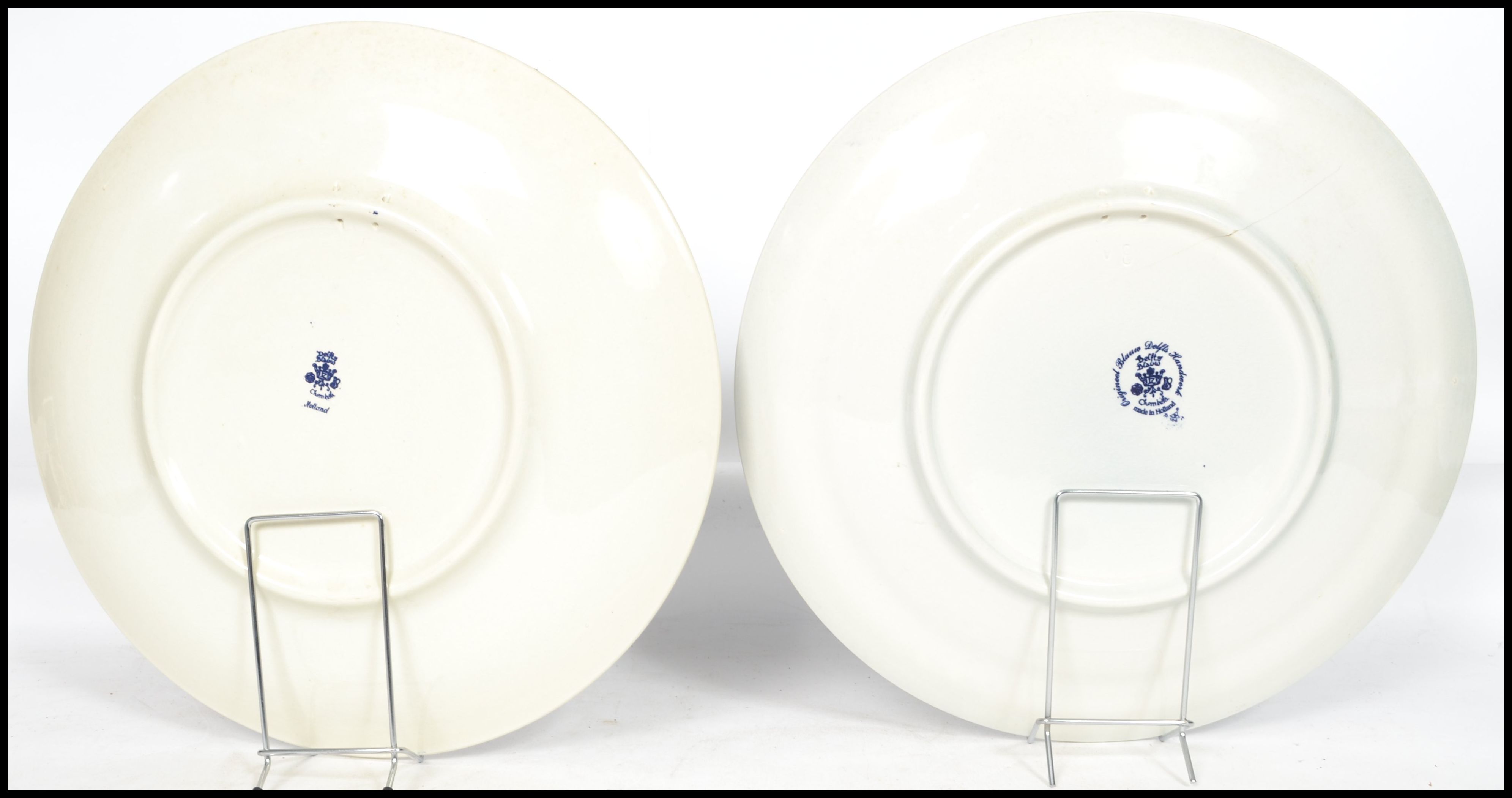 Two 20th century Delft ceramic wall hanging charger plates each having a central tondo depicting - Image 8 of 10