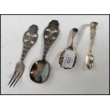 A silver hallmarked caddy spoon with shell shaped