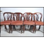 A set of 8 Regency / early Victorian mahogany balloon back dining chairs being raised on turned legs