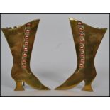 A pair of Victorian brass and copper mounted easel spill vases, each in the form of a lady`s boot,