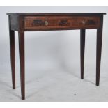 An Edwardian mahogany inlaid writing table desk being crossbanded to the borders. Raised on