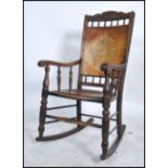 A 19th century panel seat rocking chair raised on bow sleigh runners with gallery frame to the top.