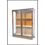 A vintage 20th century  oak china display cabinet