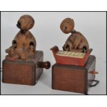 A pair of 19th century Japanese Kobi / Kobe toys modelled as figures, one playing an traditional