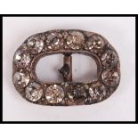 A Georgian 19th century silver and paste stone foil backed buckle brooch ( pin af ) Total weight