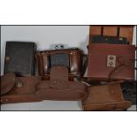 A collection of vintage cameras to include Century bellows camera being mahogany and black canvas