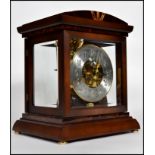 A Kieninger model RWU04 bracket mantle clock, brass dial with silvered chapter ring, subsidiary