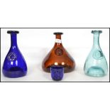 A collection of three retro 20th century studio glass Ole Winther 1960's blue and green decanters