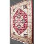 A large North Western Iranian / Persian Heriz carpet - rug having red and beige ground with