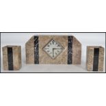 A 1920s Art Deco French marble mantel three piece clock and garniture set of angular form having