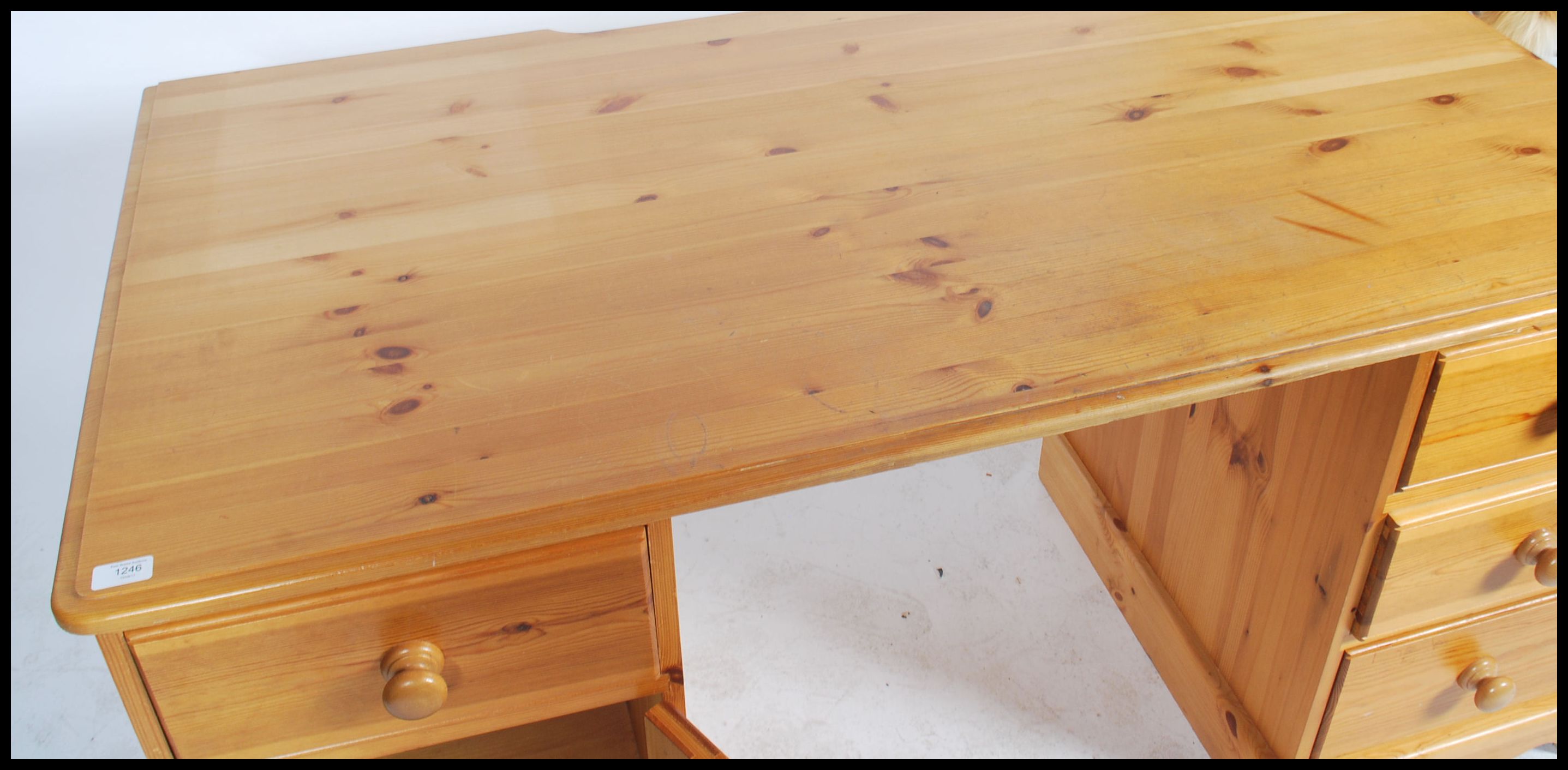 A 20th century contemporary twin pedestal pine knee hole desk having an arrangement of drawers - Image 5 of 5