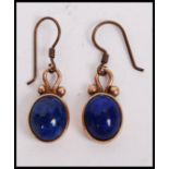 A pair of  9ct gold / 375 Lapis Lazuli ladies earrings having Lapis Lazuli insetdrops  with gold