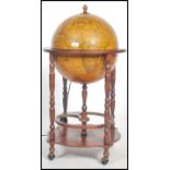 An antique style Cocktail drinks cabinet in the Form of a Globe with Hinged Top Section to Fitted