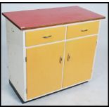A 1950's mid century Formica kitchen cabinet with short drawers and cupboards together with 2