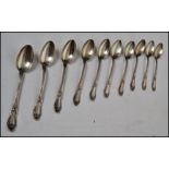 A set of ten silver tea spoons decorated in a Monte Carlo style pattern having sloped terminals