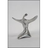 A Canadian silver white metal sculpture of abstract form depicting a bird with artist mark to base.