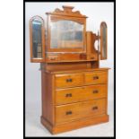 An Edwardian satin walnut dressing table chest of drawers having short over deep drawer