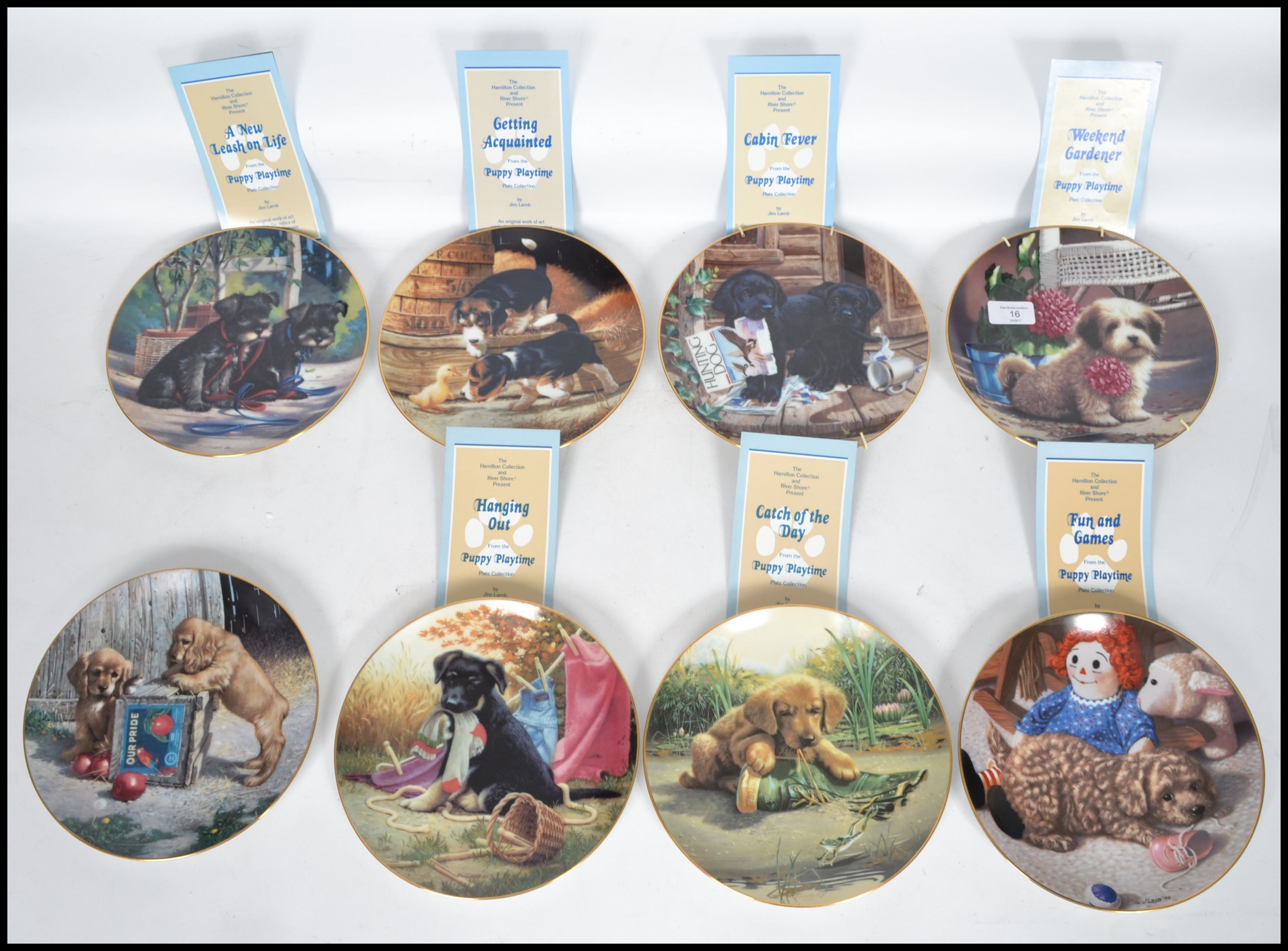 A full set of eight Hamilton Collectors plates with a series of pictures depicting Puppies