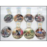 A full set of eight Hamilton Collectors plates with a series of pictures depicting Puppies