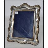 A large silver hallmarked easel back picture frame