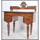 A 19th century Italian walnut biedermeier writing table desk being raised on inset turned legs