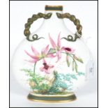 A 19th century Minton moon flask vase hand painted with flora on a white ground with naturalistic