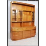 A 1970's G-Plan style teak wood sideboard comprising a base with drawers and cupboards having an