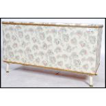 A vintage retro 20th century Ottoman blanket box, lift up lid / seat  with vinyl chintzy cover,