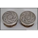 A pair of 19th / 20th century Bachelors silver buttons / cuff links, each being chase decorated.