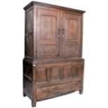 An 18th / 19th century oak armoire wardrobe having