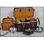 A  vintage Nikon FM2 camera and accessories to include camera bag, 50mm f1.8 lens, 24mm f2.5mm lens,