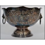 A stunning late 19th century silver plated fruit / punch bowl raised on a pedestal, having twin lion