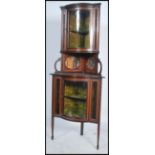 An Edwardian mahogany inlaid upright corner display cabinet having glass cabinet over gallery with