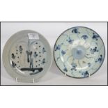 Two 19th century Oriental ceramic plates one having a central medallion with character marks to