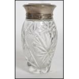 A vintage Ralph Lauren Polo glass scent bottle with silver plated lid with label to base