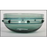 A 19th century Gothic revival Arts and Crafts movement Bristol green glass finger bowl having a